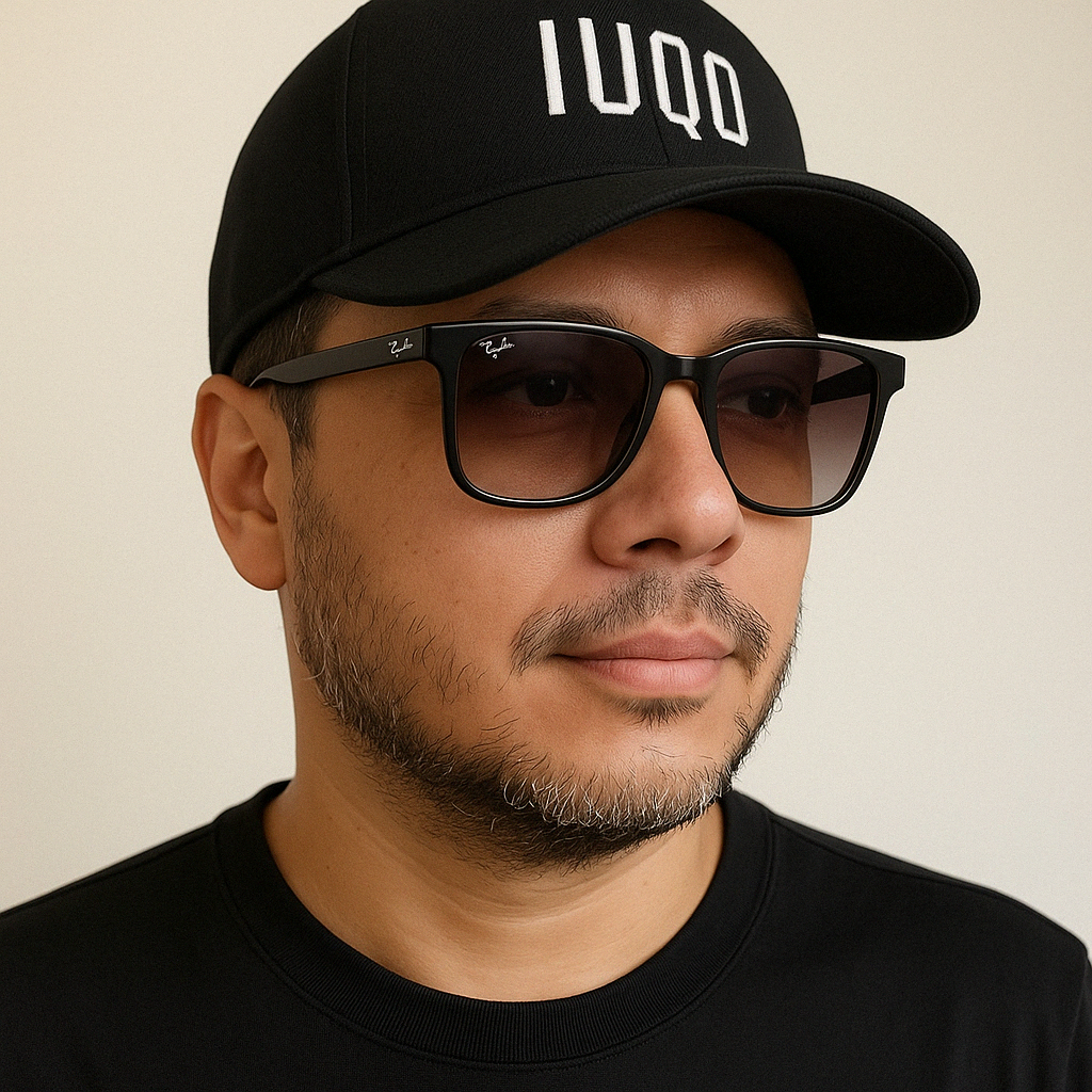 Portrait of Izaias wearing a black cap and glasses